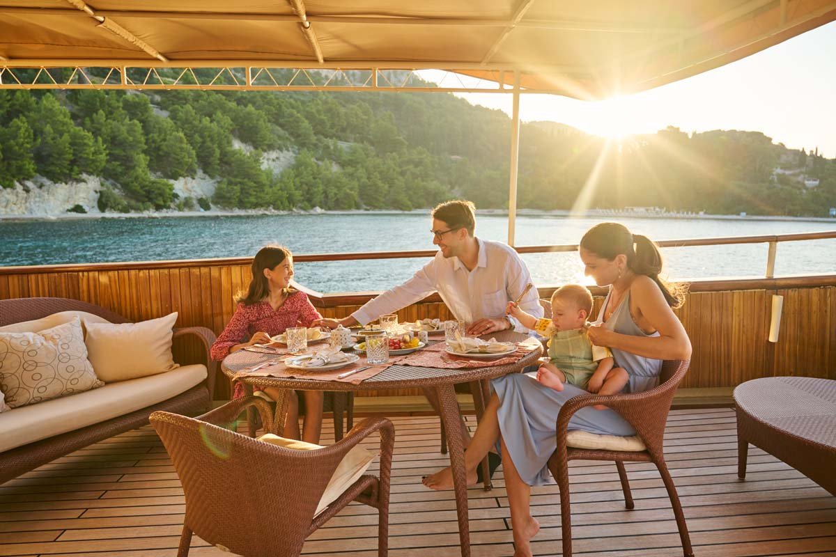Breakfast set on Seagull II's shaded deck table