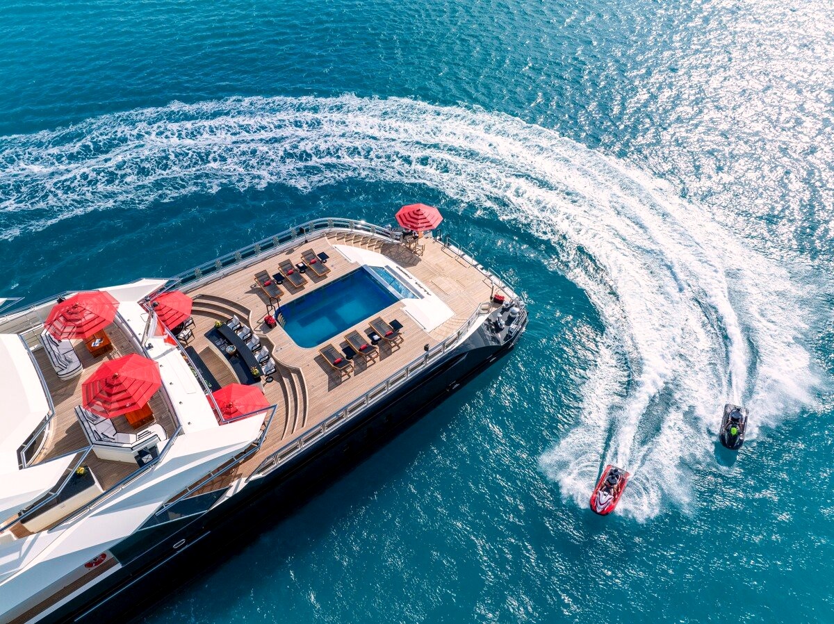 Alfa Nero from above, with her aft-deck pool and jet skis in her wake. Photo: Fraser