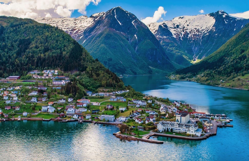 Balestrand village on the Sognefjord with snowy peaks behind
