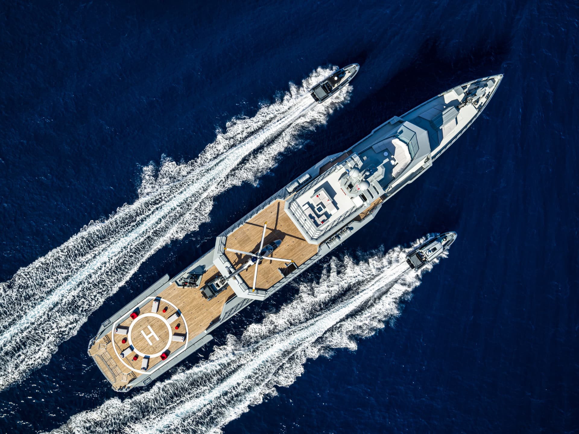 Bold seen from above with her helipad and tenders underway