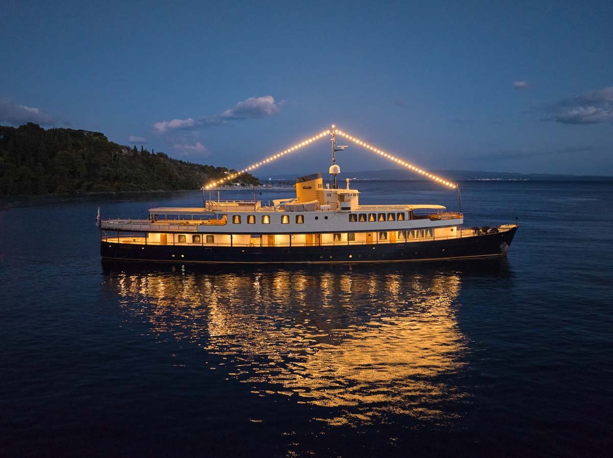 Seagull II lit up at anchor after dark