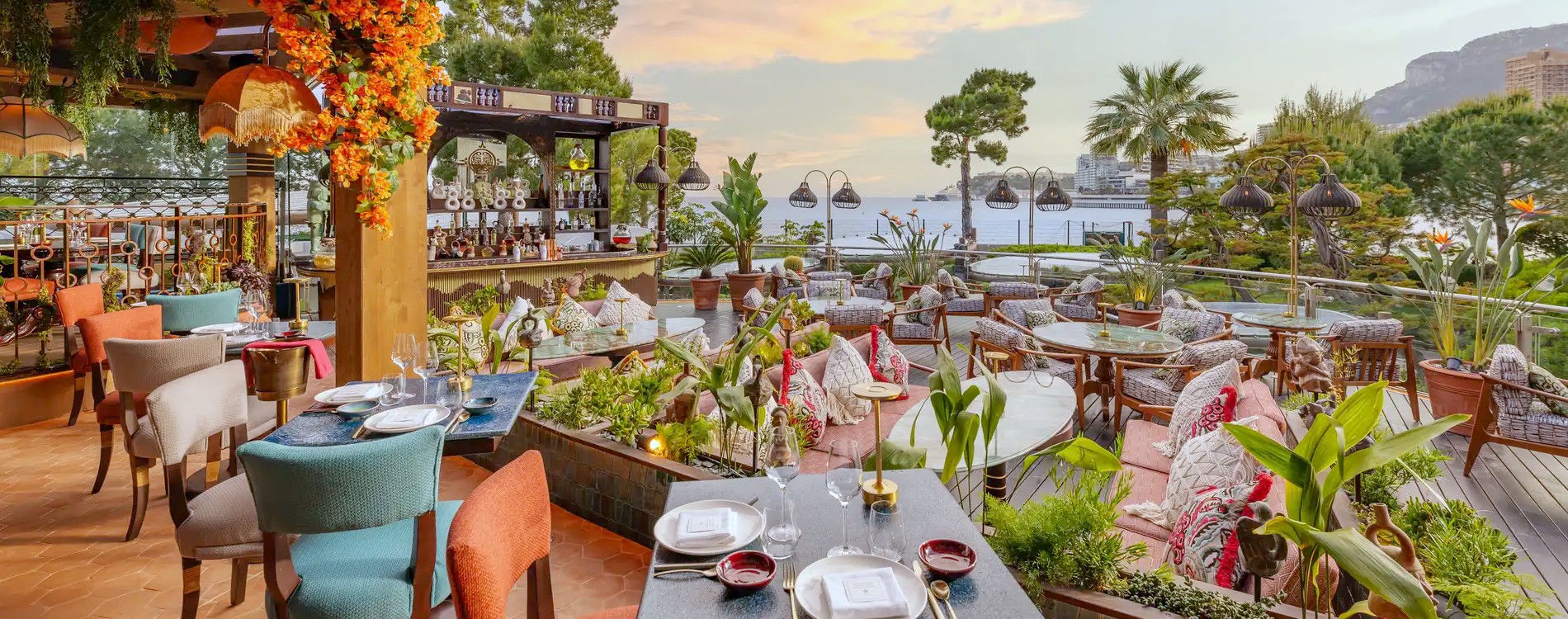 The garden terrace at Coya Monte-Carlo at sunset, looking out to sea