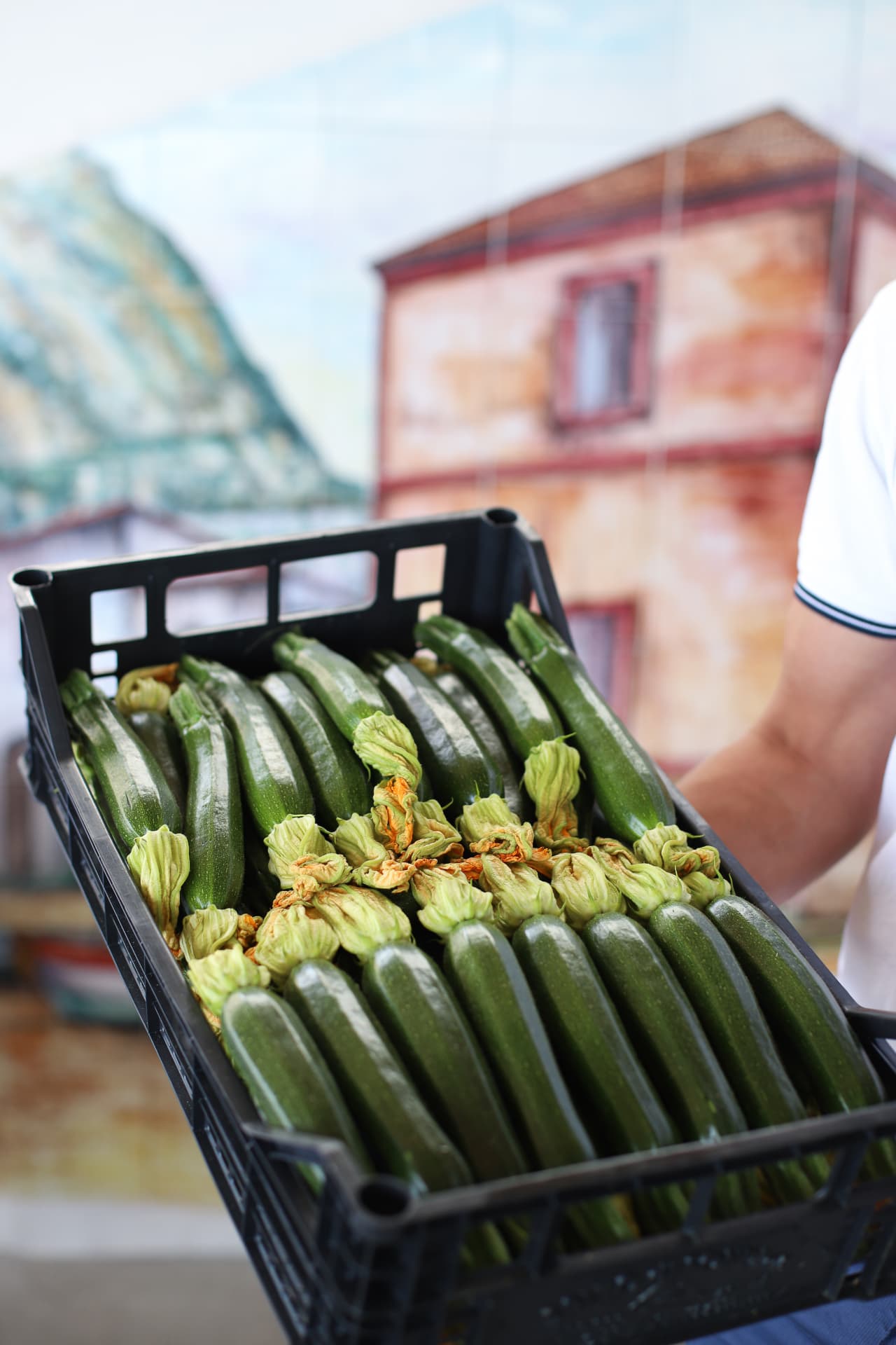 A crate of fresh zucchini flowers at Maria Grazia