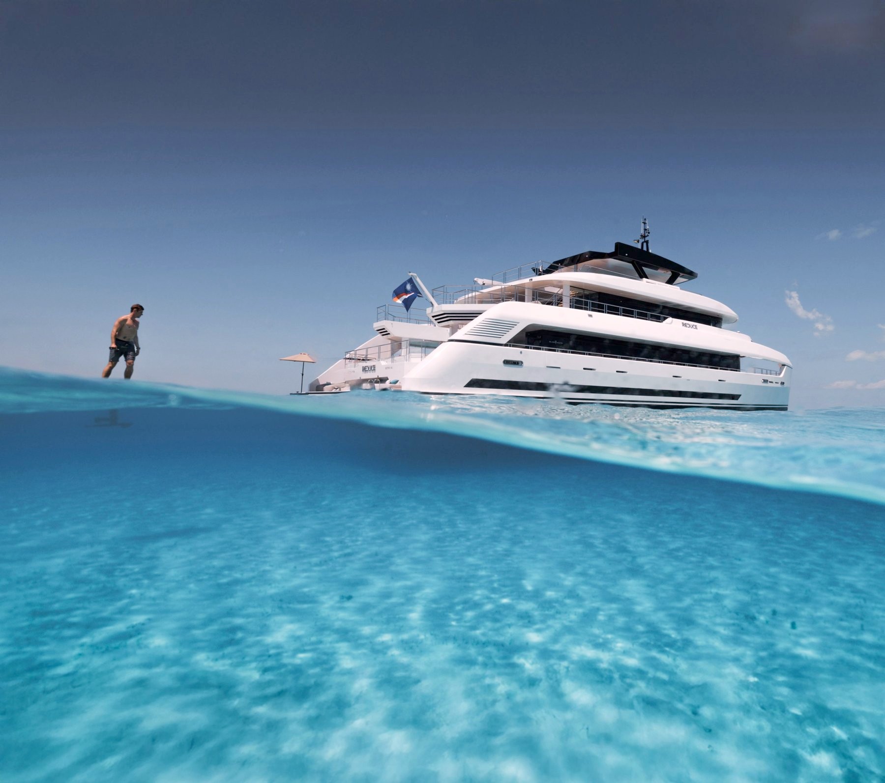 Silver Yachts' 36 m catamaran REDUCE seen from the waterline over turquoise water. Image: Silver Yachts