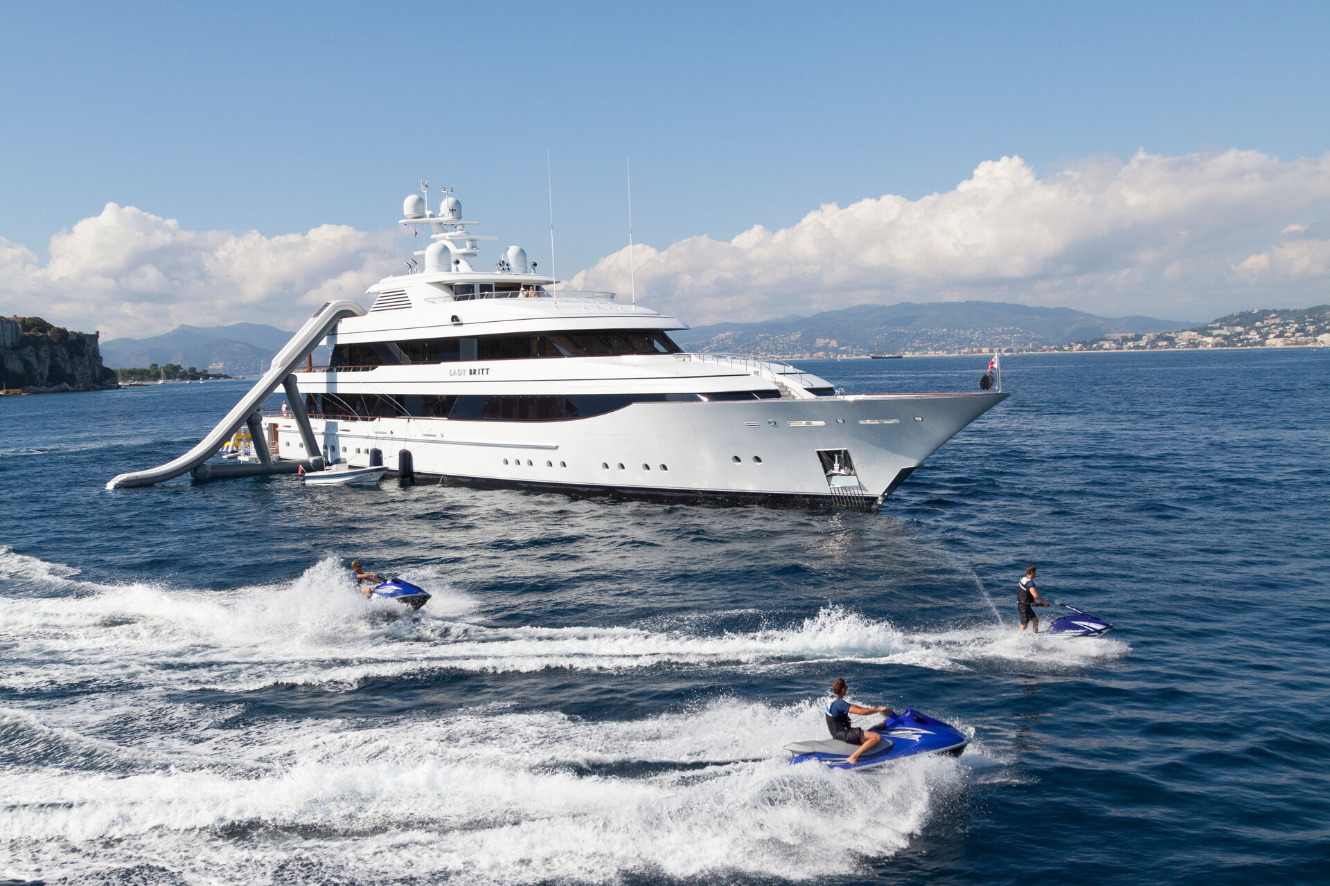 Lady Britt underway with guests on jet skis alongside