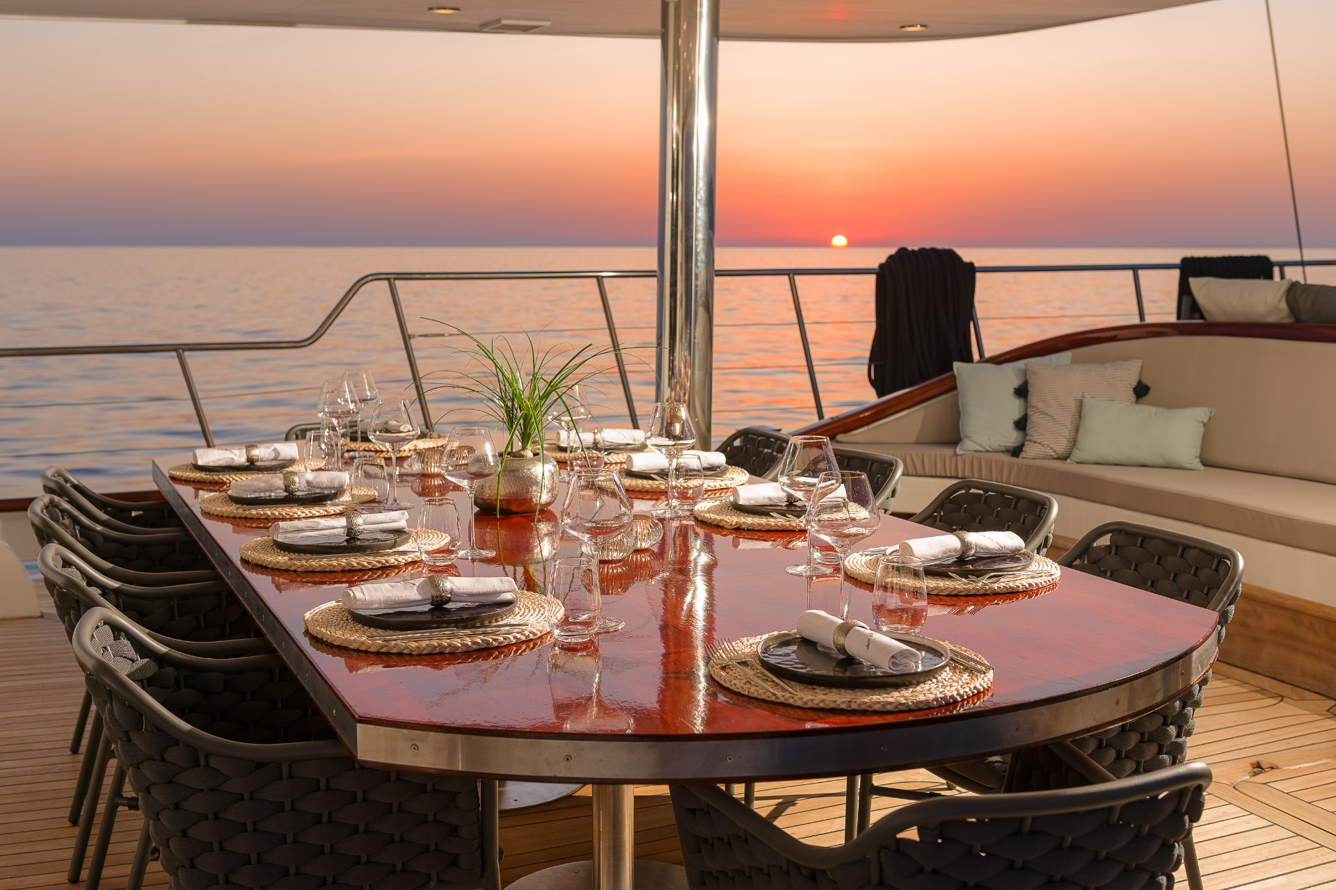 Lady Gita's aft deck dining table set for guests
