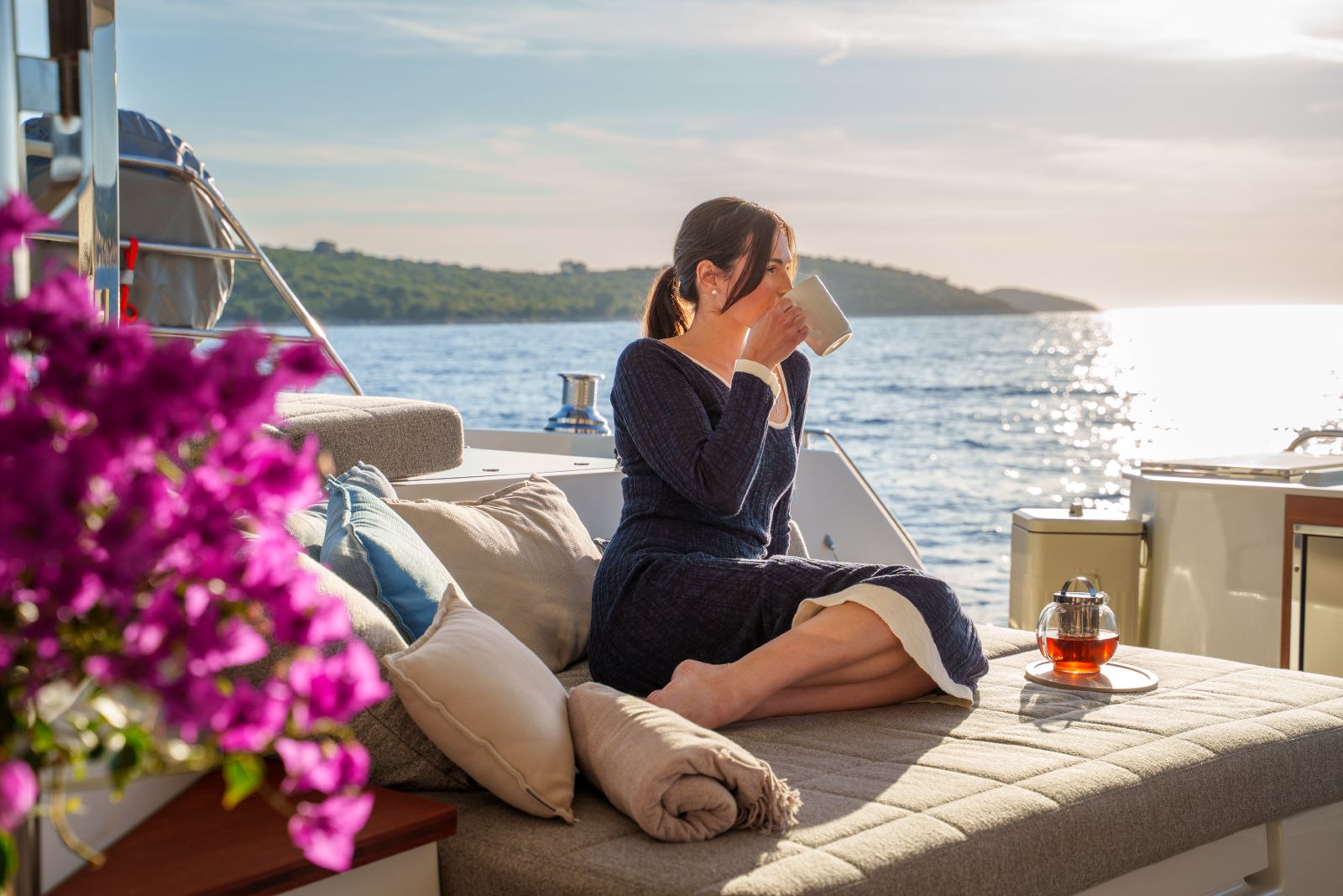 Guest enjoying morning tea on Floramye's sun deck