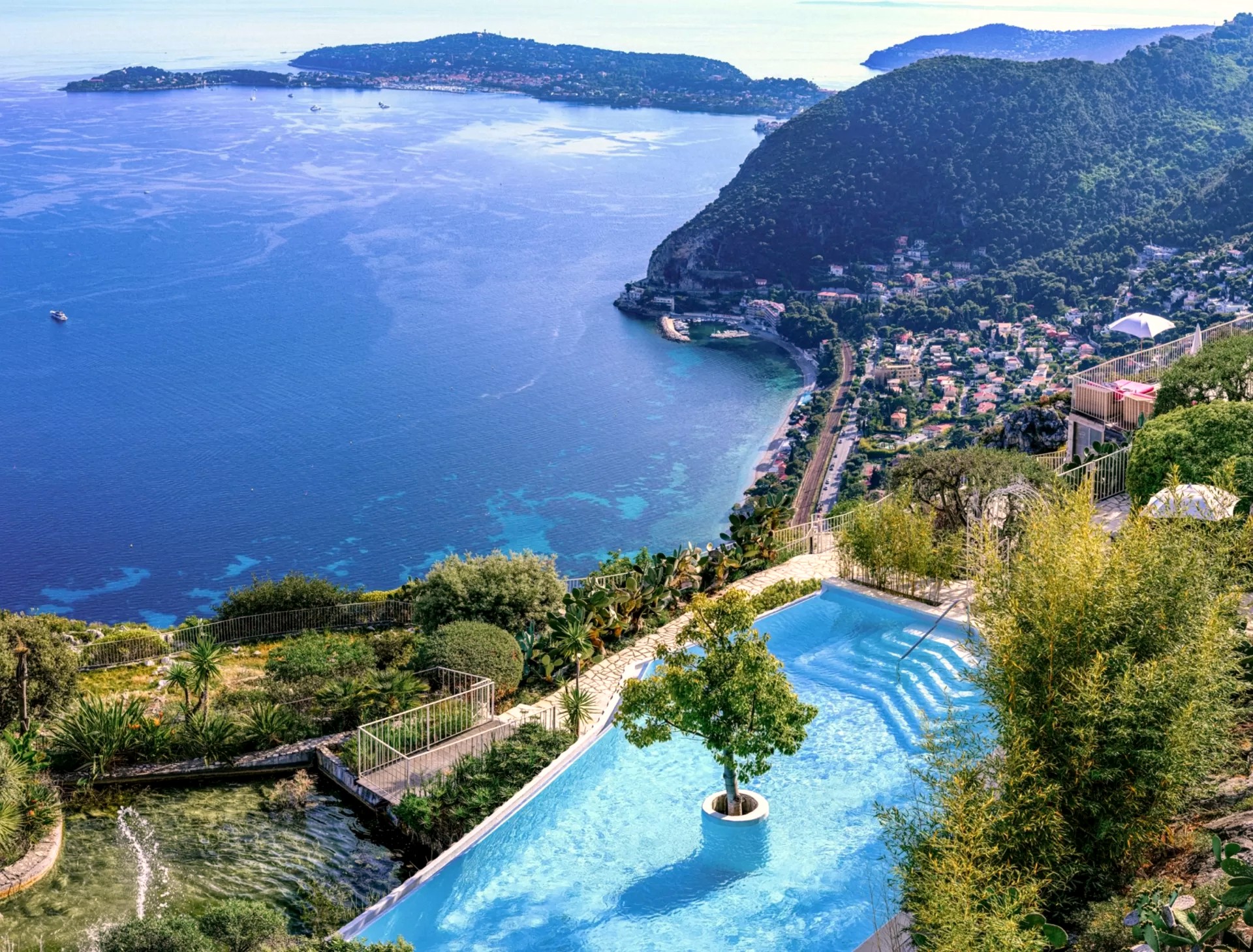 The pool at Château de la Chèvre d'Or high above the bay and Cap Ferrat