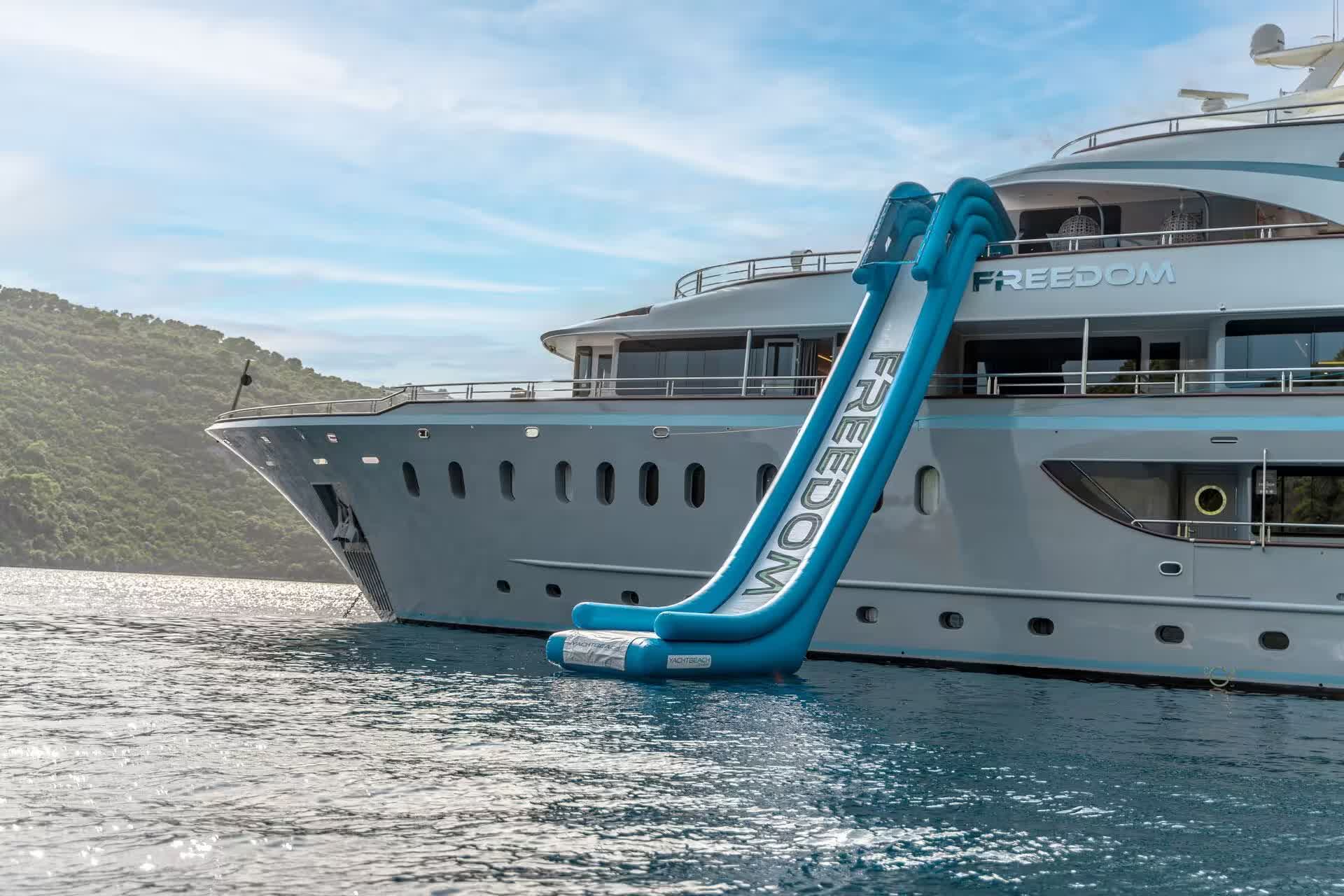 A yacht waterslide into a calm bay