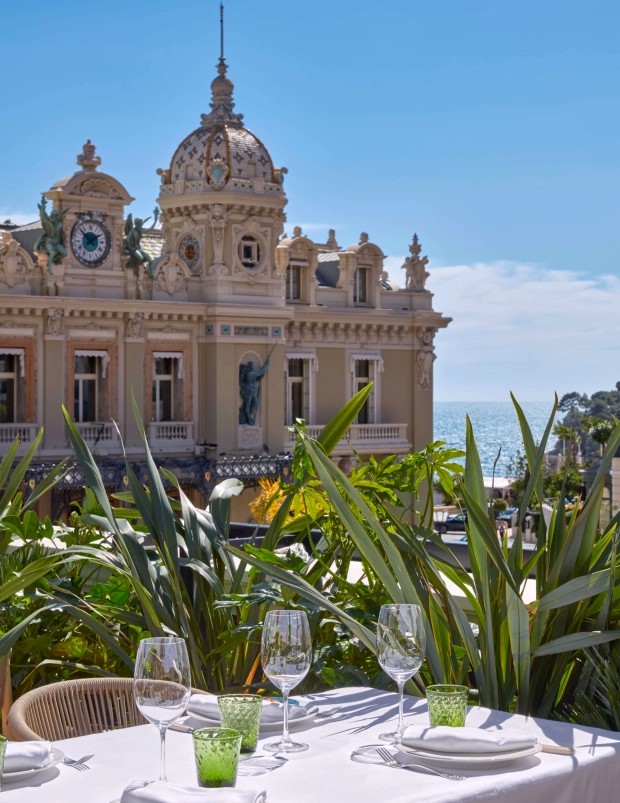 A table set on the terrace at Amazonico, facing the Casino and the sea