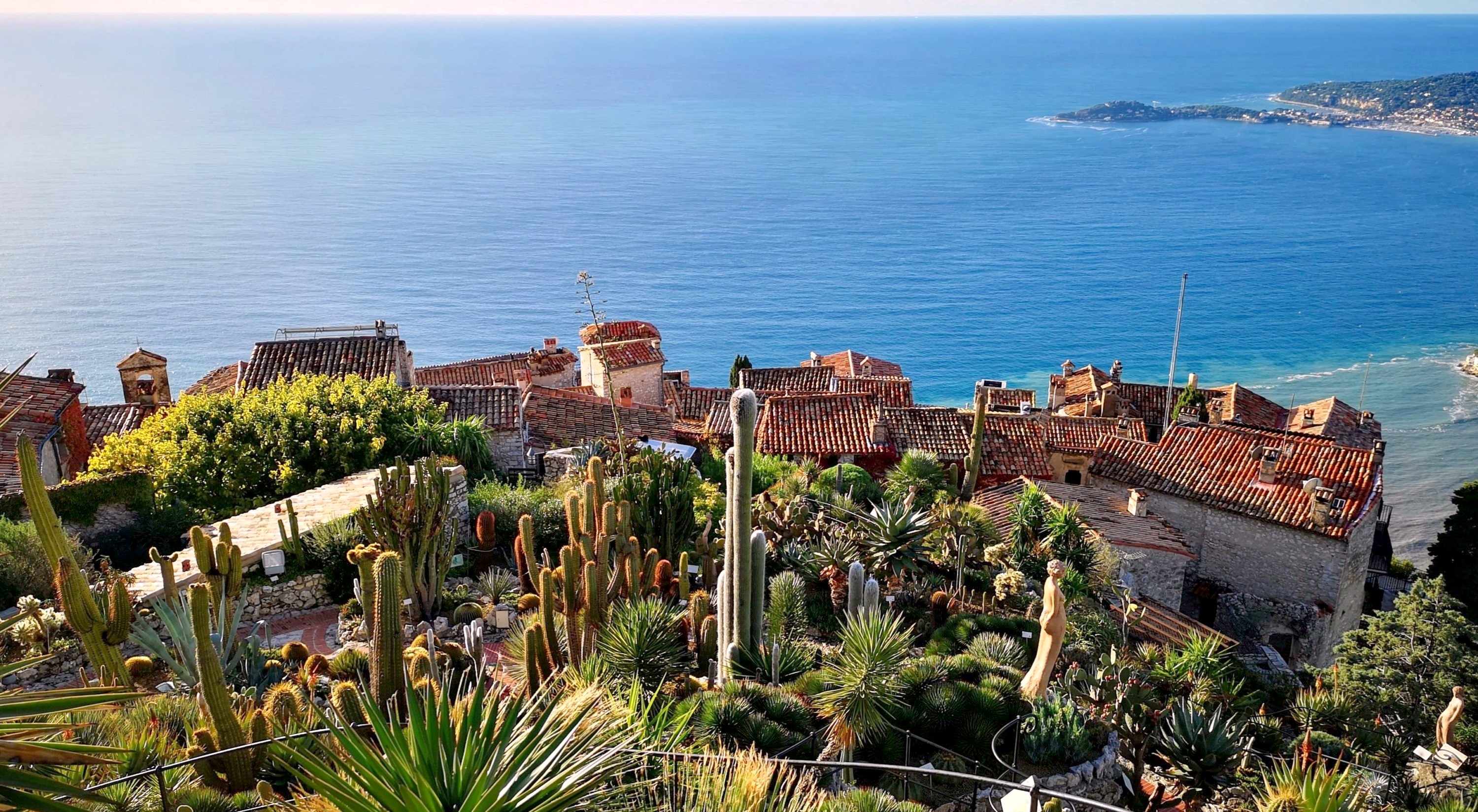 The exotic garden of Èze with the village rooftops and the sea below