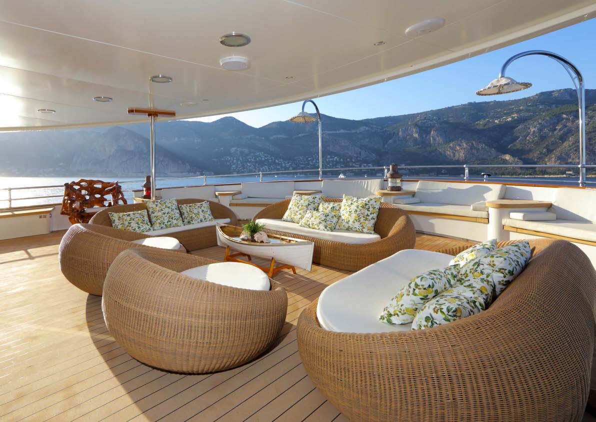 Sherakhan's shaded deck lounge with rattan armchairs