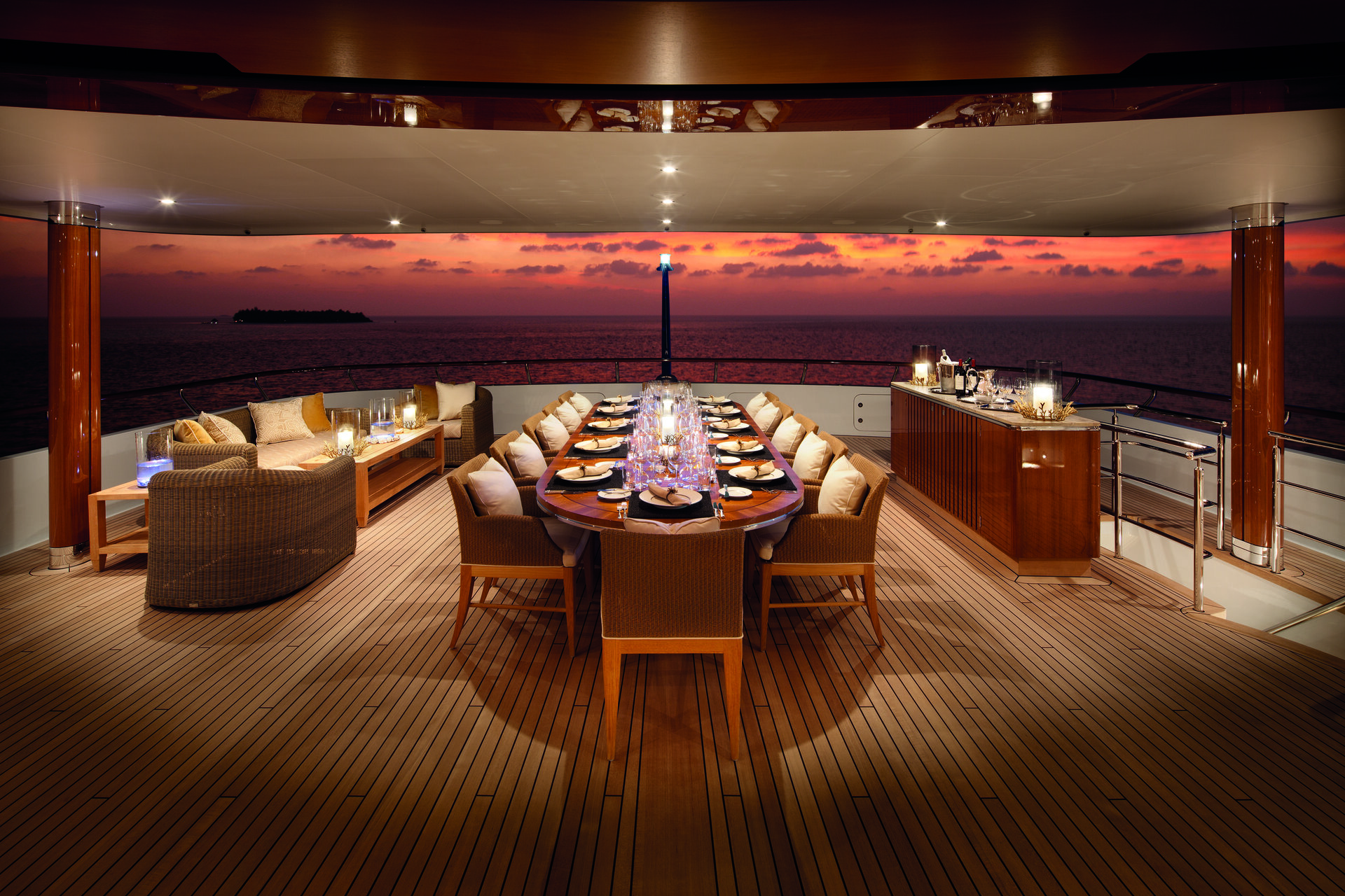 Lady Britt's upper deck dining table set at sunset
