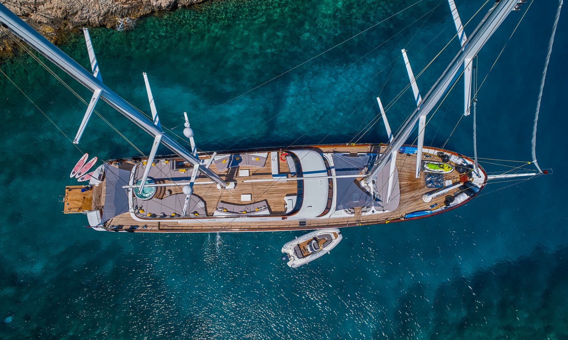 Lady Gita's decks seen from above with her distinctive sailing rig